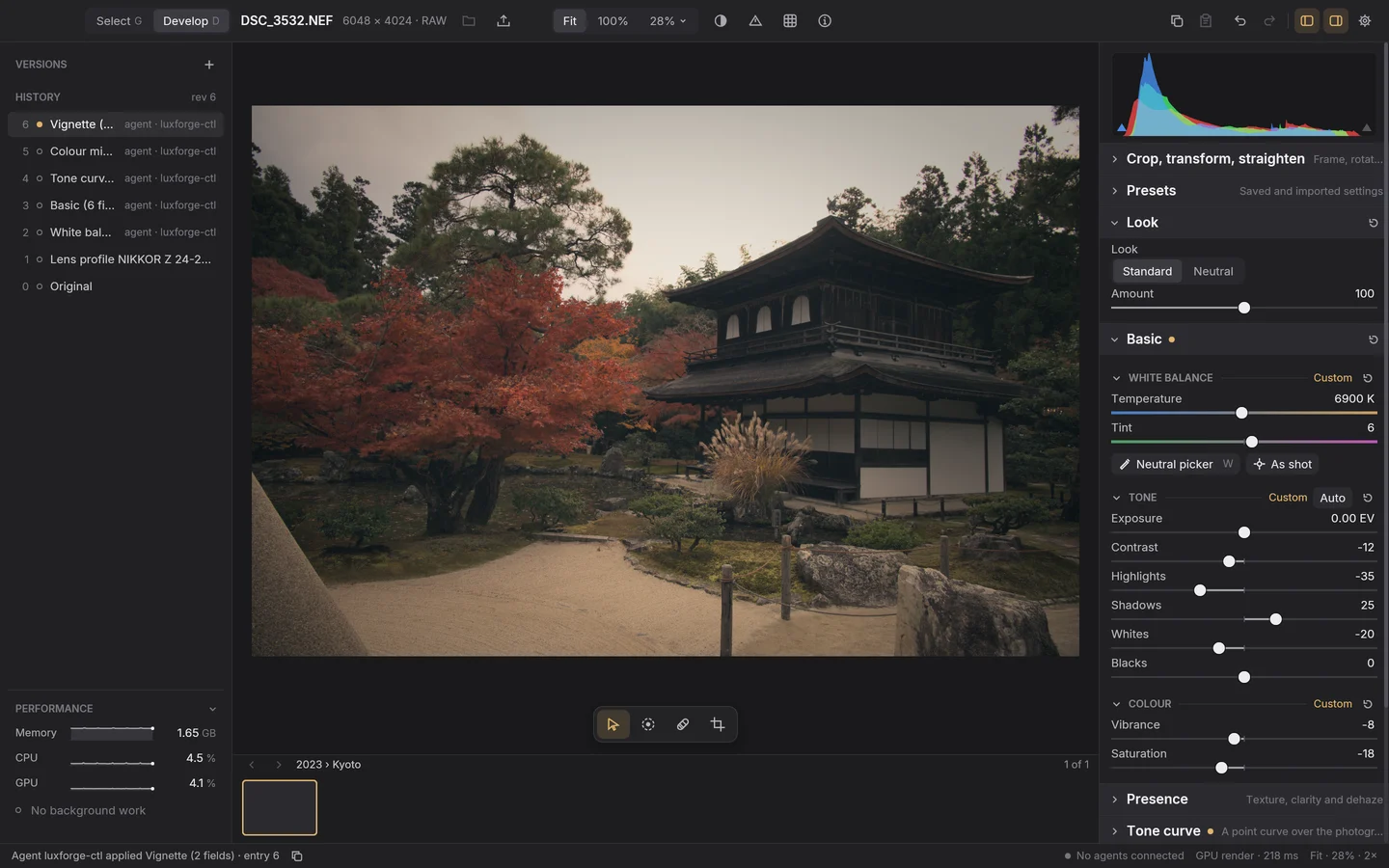 Plate II. The Develop workspace after the agent’s edit: Ginkaku-ji in faded, warm colour; history entries 2 to 6 (White balance, Basic, Tone curve, Colour mixer and Vignette) each by ‘agent · luxforge-ctl’; Basic showing 6900 K, Contrast −12, Highlights −35, Shadows 25, Whites −20, Vibrance −8 and Saturation −18; and the status bar saying ‘Agent luxforge-ctl applied Vignette (2 fields) · entry 6’.